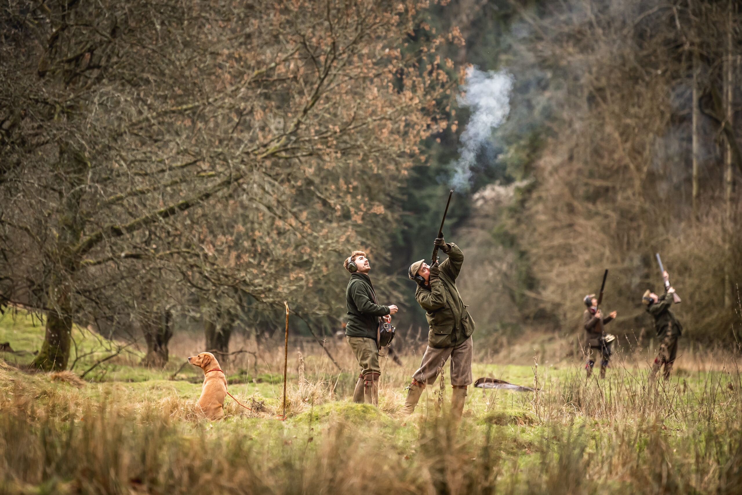 Man on peg taking a shot and smoke coming out of the end of the barrels