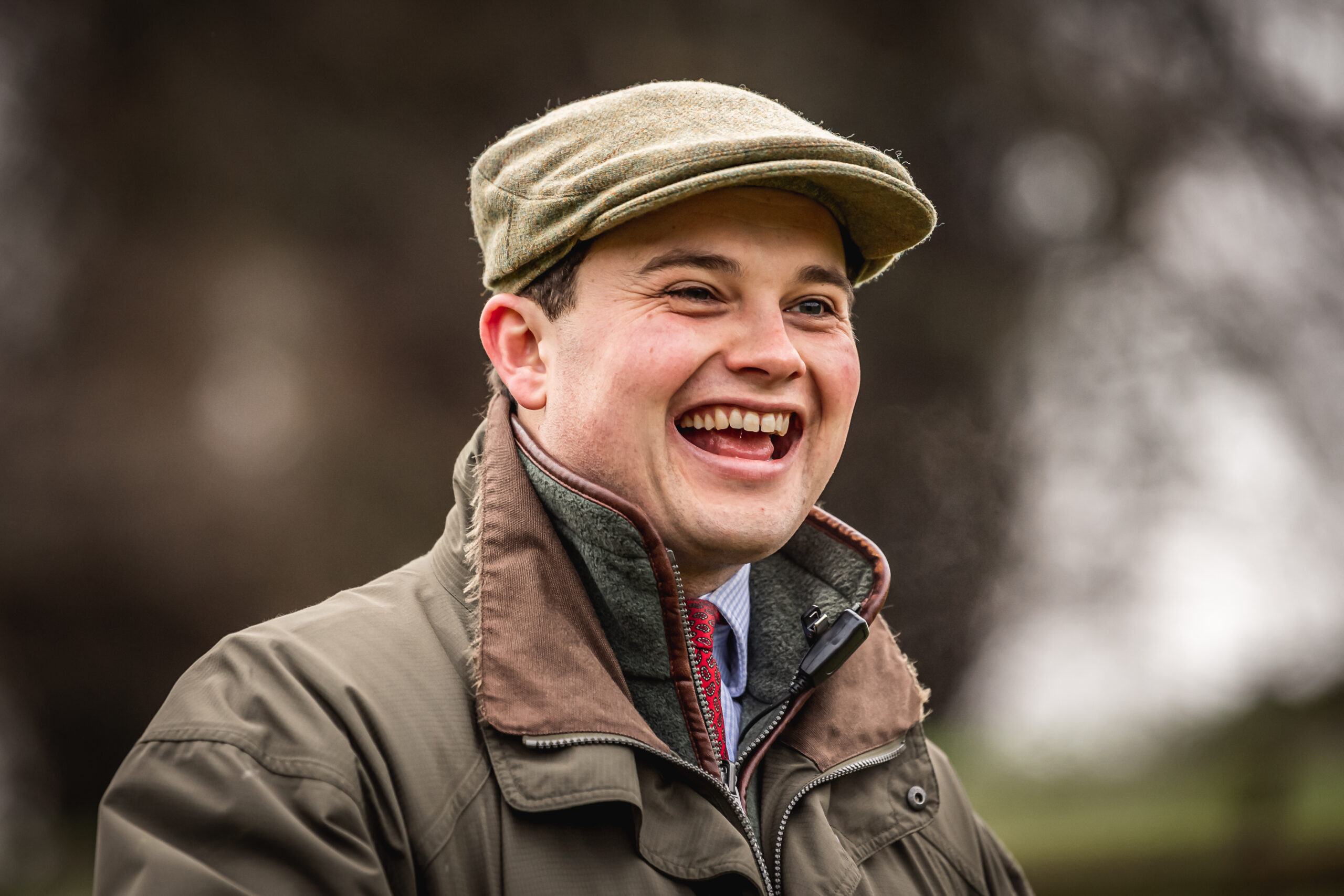 Man in technical country wear laughing on a days shooting