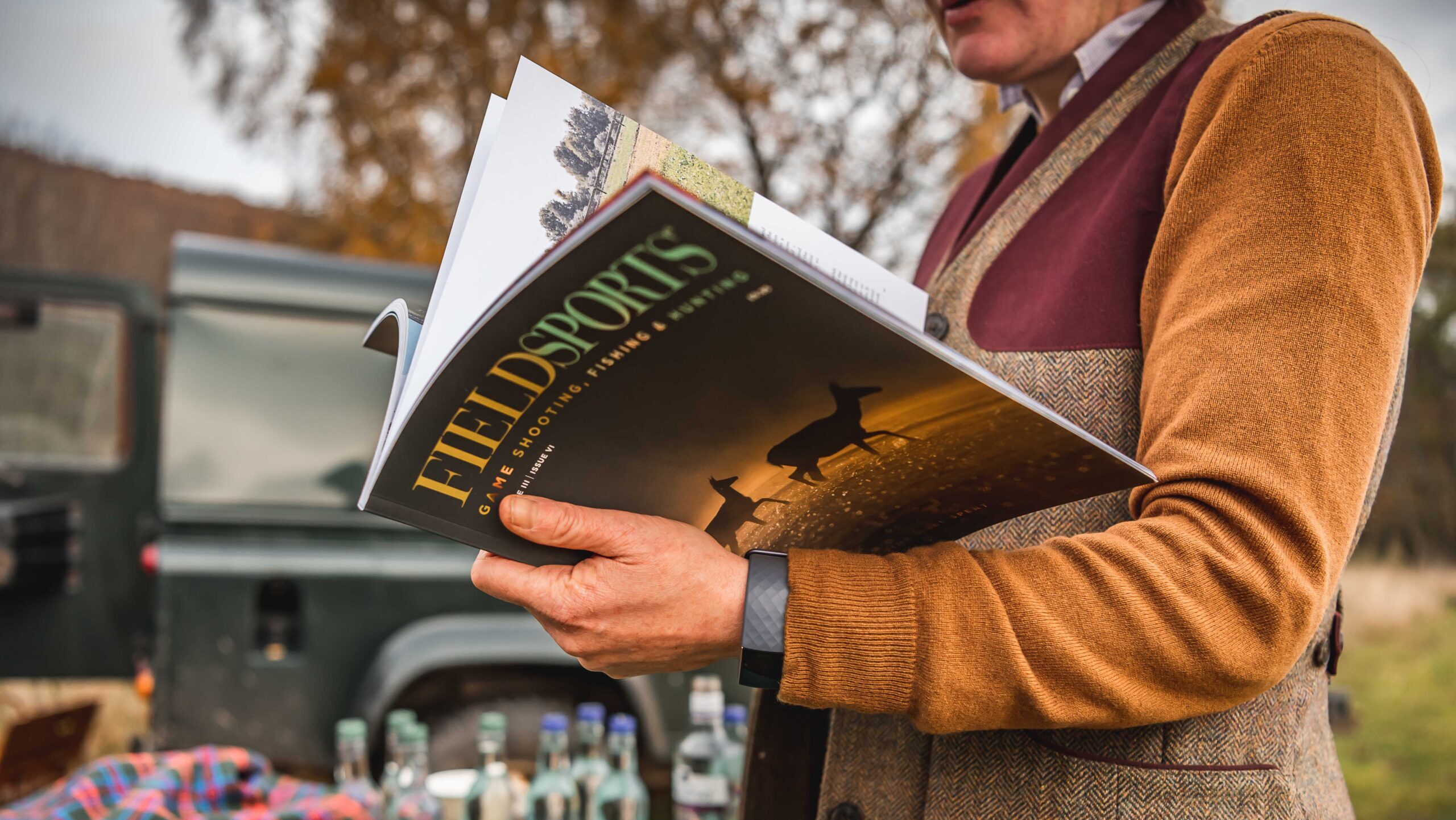 A copy of Fieldsports Journal being read out in the field