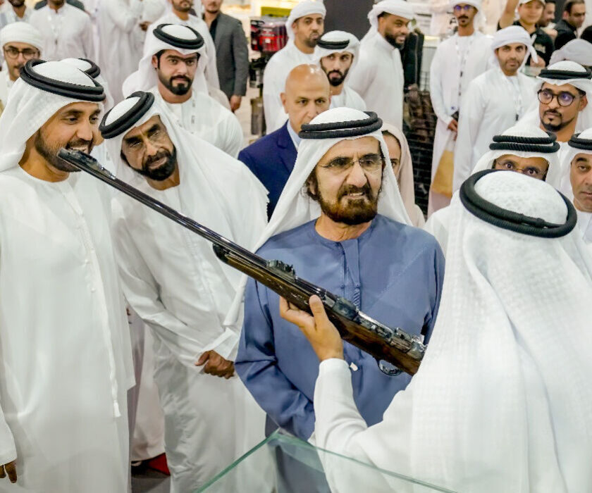 His Highness Sheikh Mohammed bin Rashid Al Maktoum, Vice President and Prime Minister of the UAE and Ruler of Duba being shown a gun whilst at the Middle East Hunting Expo.