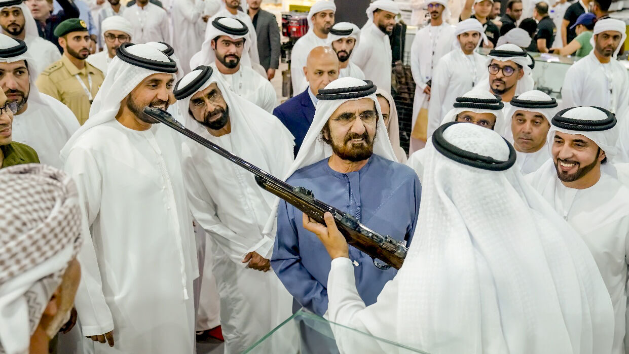 His Highness Sheikh Mohammed bin Rashid Al Maktoum, Vice President and Prime Minister of the UAE and Ruler of Duba being shown a gun whilst at the Middle East Hunting Expo.